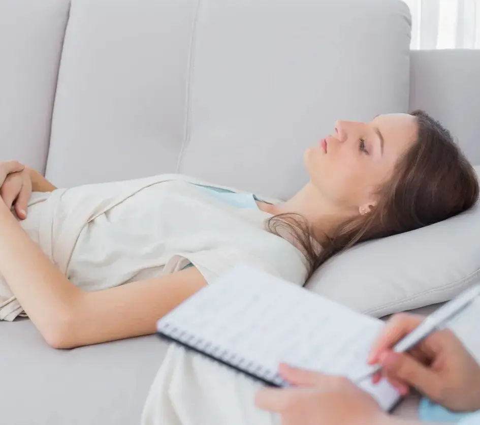 Woman lying on couch during therapy session
