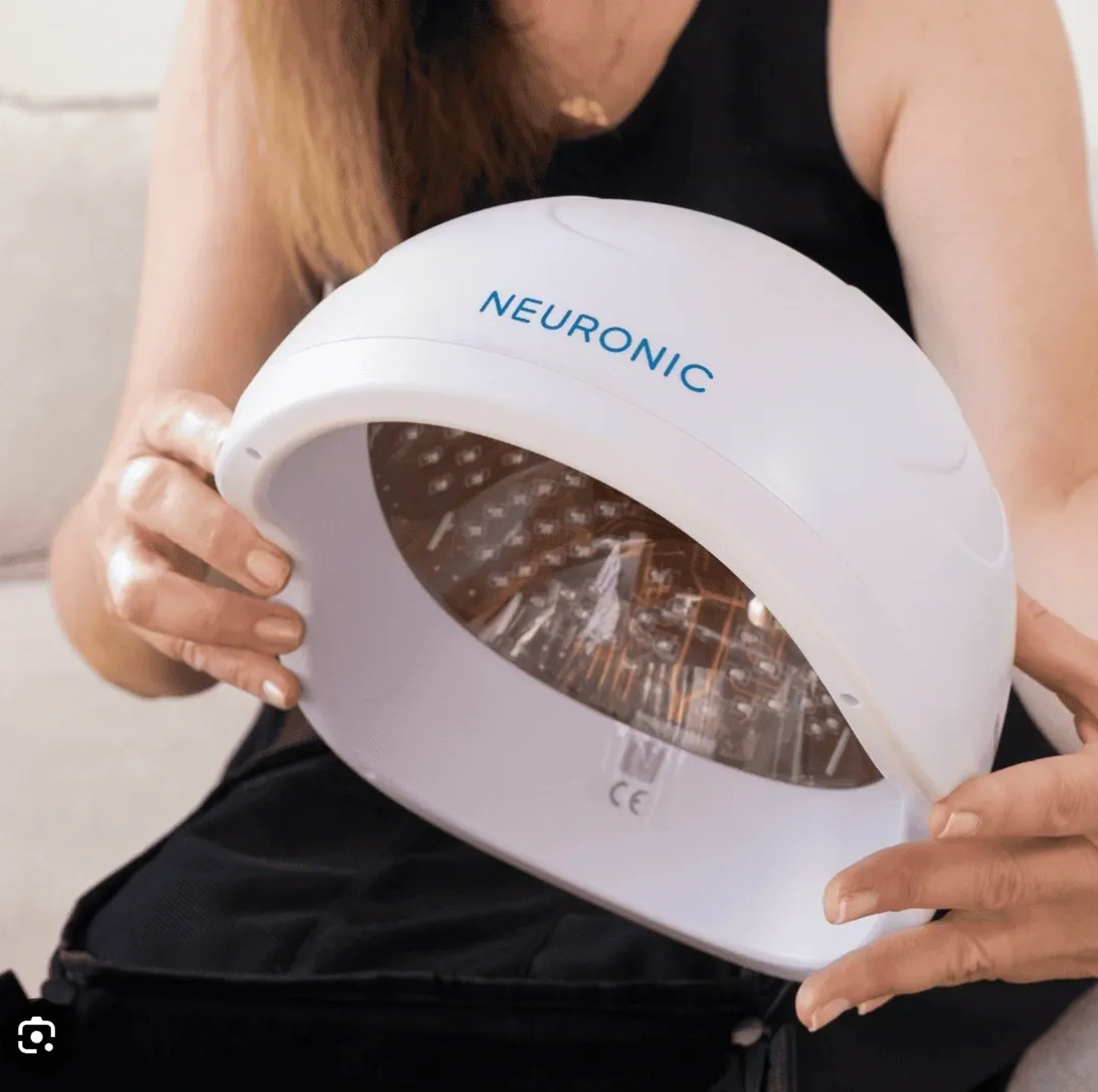 Hands holding a dome-shaped device