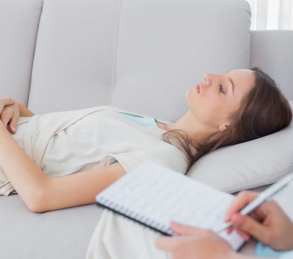 Woman lying on couch during therapy session