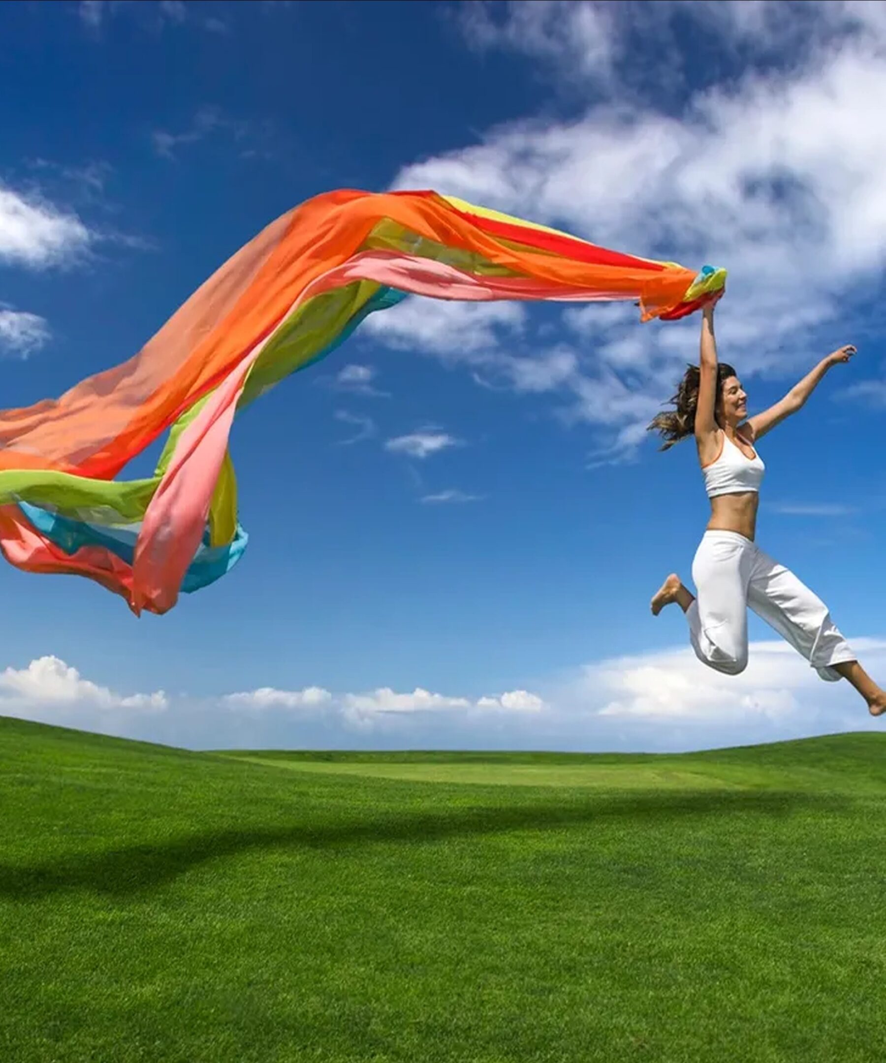 Joyful leap in grassy field